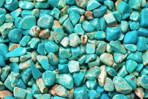 Turquoise is a mineral widely used as a gemstone. Its color ranges from bright blue to blue-green. Turquoise is relatively soft, and so it is easy to shape and polish. The turquoise shown in this photo has been polished. Credit: © Akulinina Olga, Shutterstock