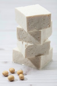 Tofu is a food made of soybean curds pressed into cakes or blocks. Credit: © Shutterstock