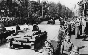 Germany's blitzkrieg (lightning war) overran Poland at the outbreak of World War II in 1939. German dictator Adolf Hitler, far right , reviewed German tanks as they paraded through the streets of Warsaw. Credit: AP/Wide World 