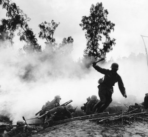 This photograph shows German troops attacking from a trench early in World War II (1939-1945). Germany started the war in Europe by launching an attack on Poland in September 1939. World War II killed more people, destroyed more property, and disrupted more lives than any other war in history. Credit: AP Photo 