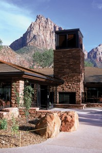 Zion National Park lies in southwestern Utah. It has many colorful canyons and unusual rock formations. This picture shows the park's visitor center. The park's steep cliffs rise in the background. Credit: National Renewable Energy Laboratory 
