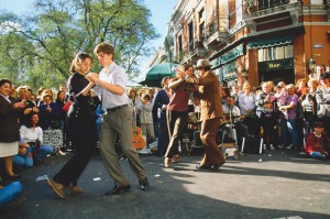 Tango is the national dance and music of Argentina. The couples shown here are dancing in a street in Buenos Aires, where tango originated. Credit:  © Robert Frerck, Stone/Getty Images 