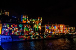 Saone waterfront with "Merci Marie/ Thanks Mary" illumination during the Fete des Lumieres - Illumination festival in Lyon. Credit: © Nicotrex/Shutterstock 