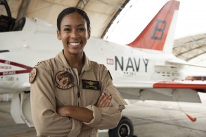 Madeline Swegle, the United States Navy’s first Black female tactical air pilot, stands in front of a T-45C Goshawk jet trainer aircraft at the Naval Air Station in Kingsville, Texas. Credit: Michelle Tucker, U.S. Navy 