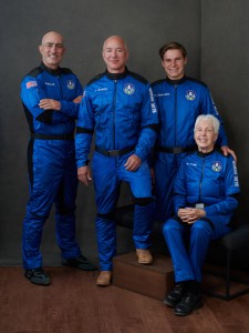American businessman Jeff Bezos poses with the other passengers New Shepard’s first crewed flight to space. From left to right: Mark Bezos, American executive; Jeff Bezos, founder of Blue Origin; Oliver Daemen, Dutch physics student; and Wally Funk, American pilot and aviation expert. Credit: © Blue Origin