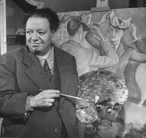 Diego Rivera was a Mexican artist who was famous for painting murals that portrayed Mexican life and history. Rivera is shown here standing in front of one of his paintings. © Ed Clark, Time Life Pictures/Getty Images