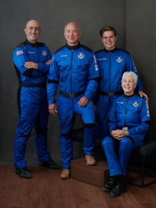 The American businessman Jeff Bezos poses with the other passengers on the first crewed flight into space of Blue Origin's craft New Shepard: (left to right) Mark Bezos, American executive; Jeff Bezos, founder of Blue Origin; Oliver Daemen, Dutch student; and Wally Funk, American aviation pioneer. © Blue Origin