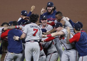 Atlanta Braves players celebrate on the field at Minute Maid Park in Houston, Texas, after recording the final out of the World Series. The Braves defeated the Houston Astros in the best-of-seven series, finishing with a 7-0 shutout in Game 6 on Nov. 2, 2021. Credit: Johnny Angelillo; UPI/Alamy 