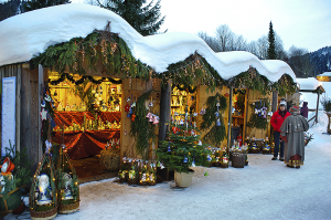 A festive Christmas market in Ettal, Germany, offers a variety of Christmas decorations and gifts. Germany is known for such markets, which fill town squares with temporary booths and shops during the holiday season. © iStock Editorial/Thinkstock