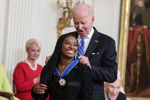 American gymnast Simone Biles receives the Presidential medal of Freedom from President Joe Biden during a ceremony where President Joe Biden will award the Presidential Medal of Freedom to seventeen recipients in the East Room of The White House on July 7, 2022 in Washington, DC.  Credit: © Oliver Contreras, SIPA USA/Alamy Images