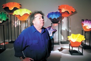 Glassmaking is a popular form of the decorative arts. Dale Chihuly is one of the leading glass artists in the United States. Some of Chihuly's glass sculptures are shown in the background. Credit: AP/Wide World