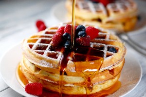 Waffles are often served for breakfast with syrup and fruit. Credit: © olga's captured moments/Shutterstock