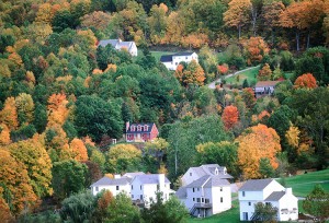 A Connecticut village in autumn is ablaze with the brilliant colors of turning leaves. Every year, many vacationers visit the state to enjoy its scenic countryside and to explore its many picturesque villages and historic sites. Credit: © Corbis Bridge/Alamy Images