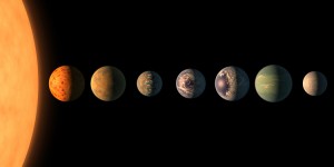 This artist's illustration shows what the TRAPPIST-1 planetary system may look like. The planetary system has seven planets that rapidly orbit close to the parent star. Three of the planets orbit within the habitable zone of the star where liquid water can exist on a planet's surface. Credit: NASA/JPL-Caltech